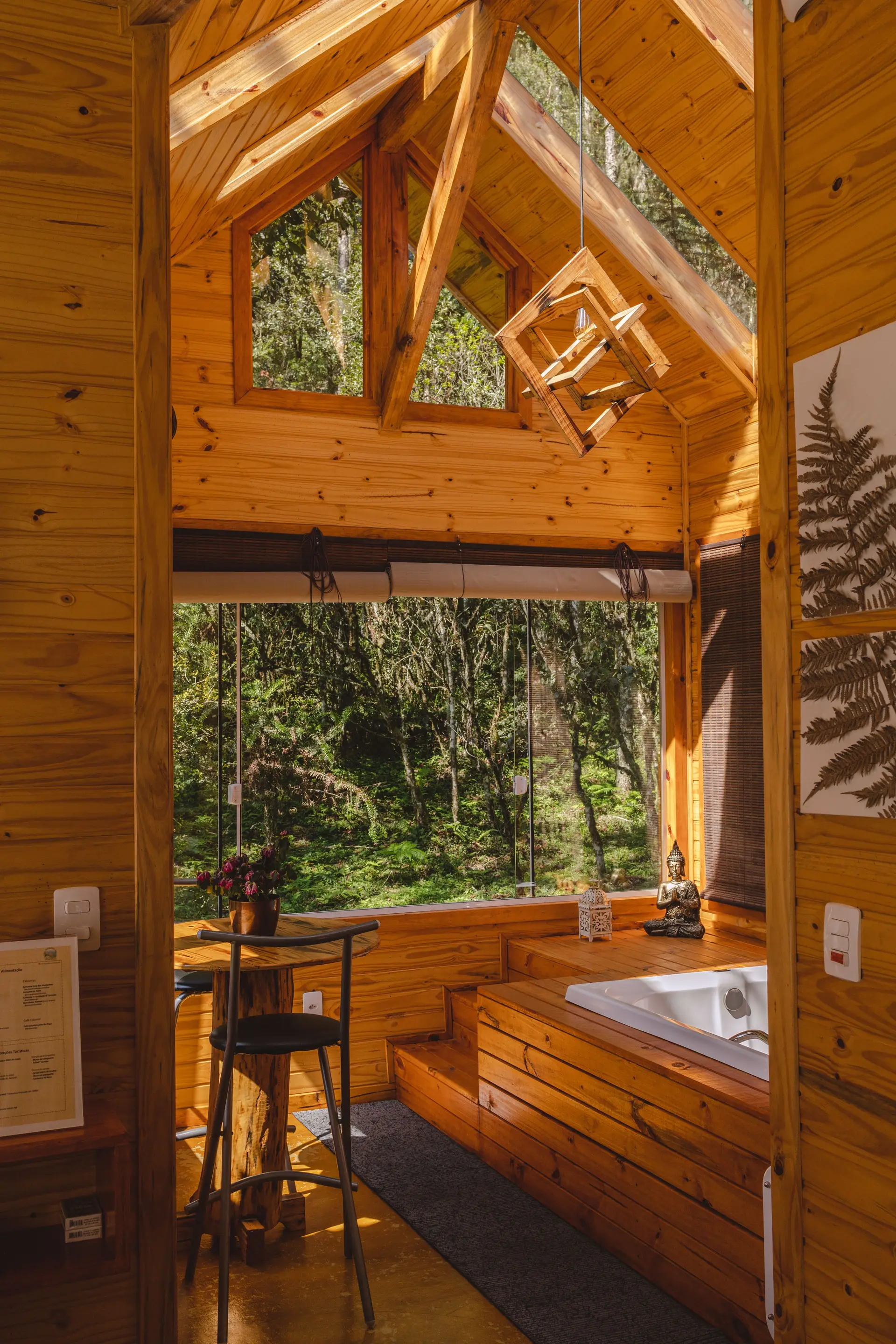 Private Nature Lodge expansive living room with handcrafted cedar timber and floor-to-ceiling wilderness vistas